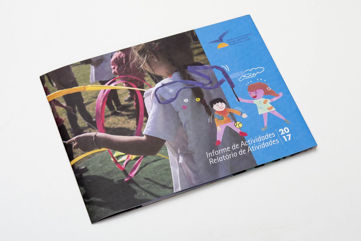 The cover of the 2017 activity report, with photography and cut-paper figures