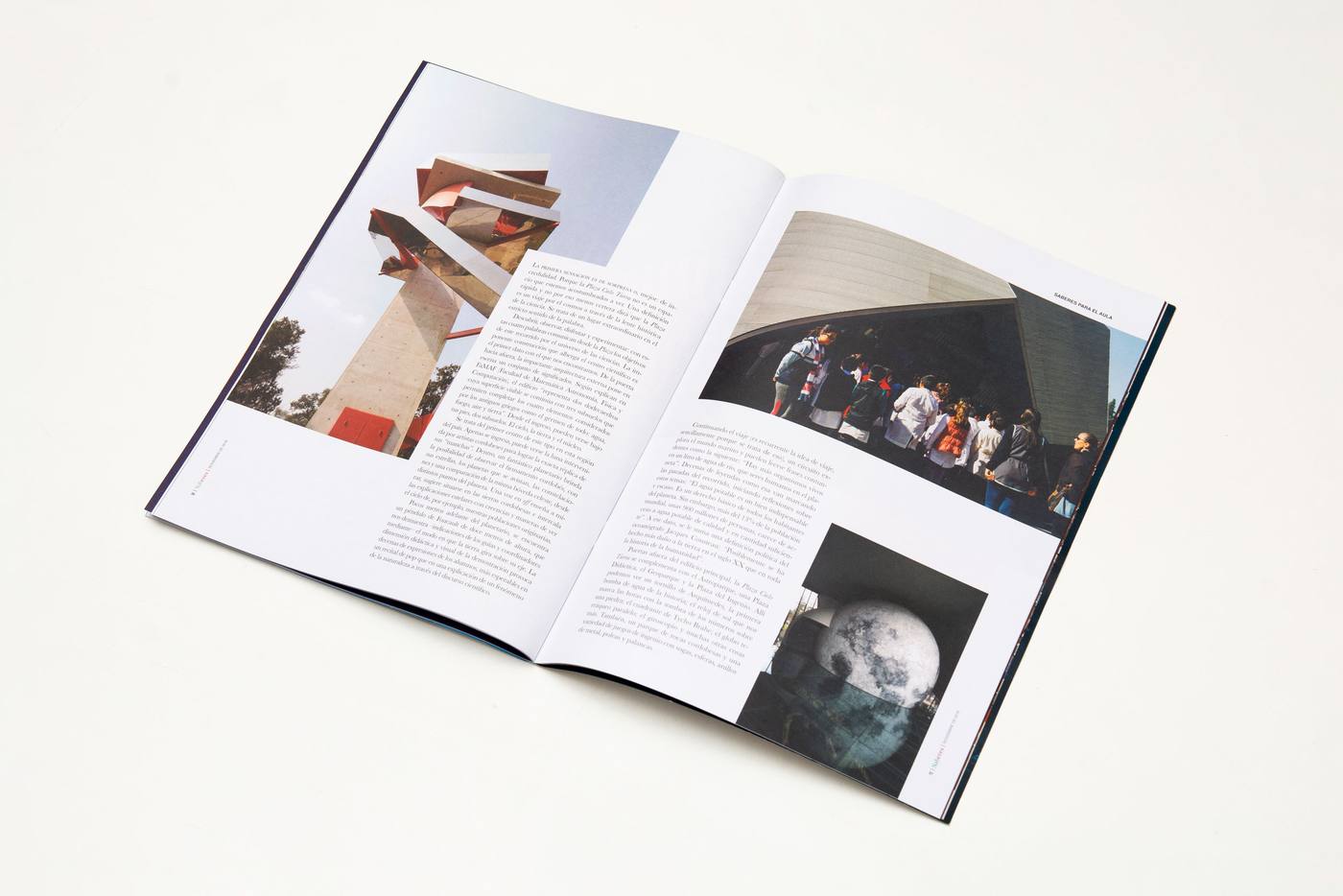 The printed magazine open on a spread of photographs